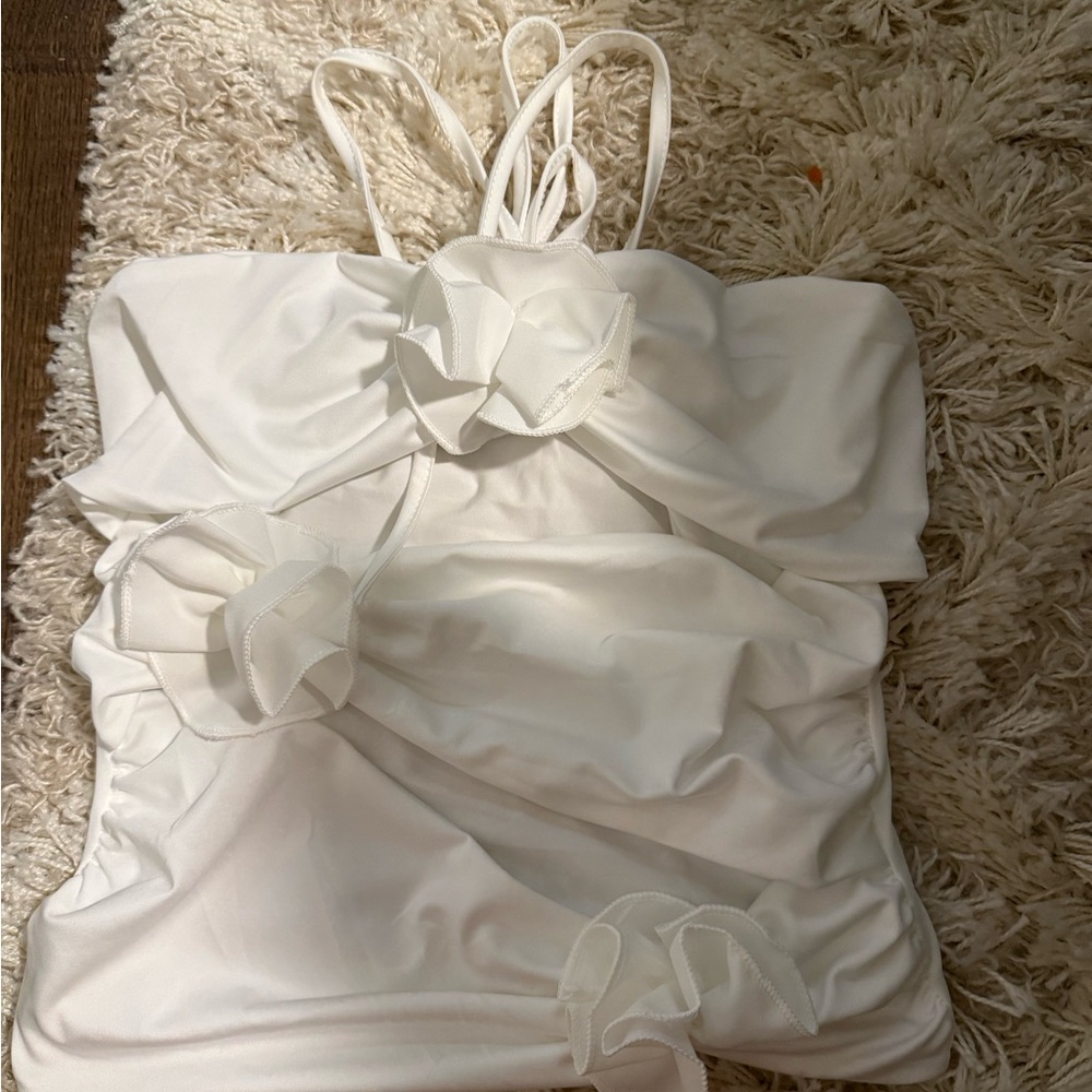 Elegant White top with Floral Accents and cutouts